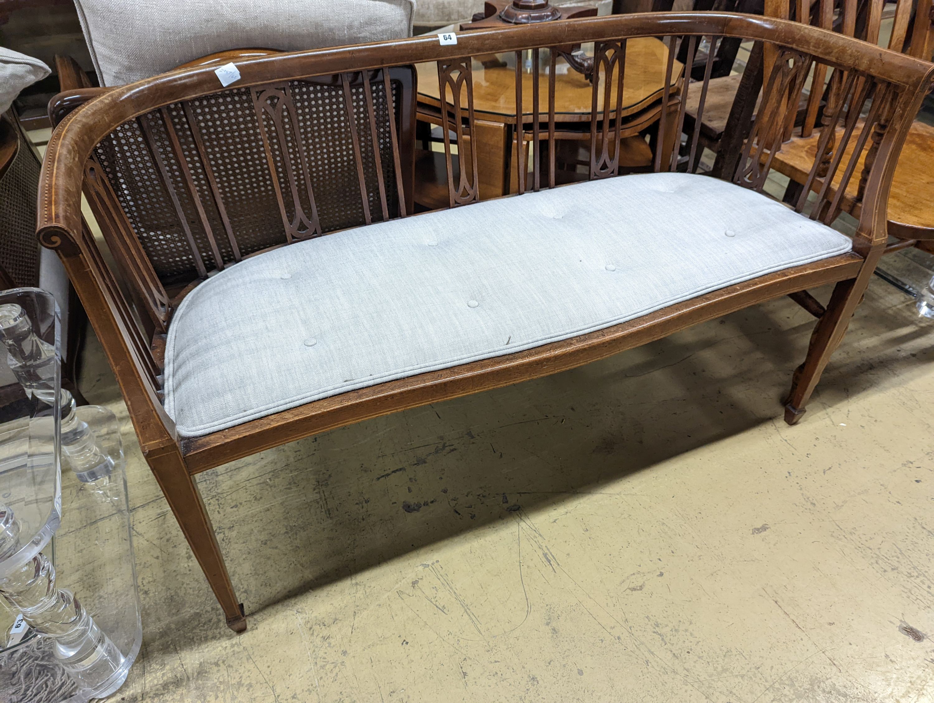 An Edwardian inlaid mahogany slat back settee, length 164cm, depth 47cm, height 74cm